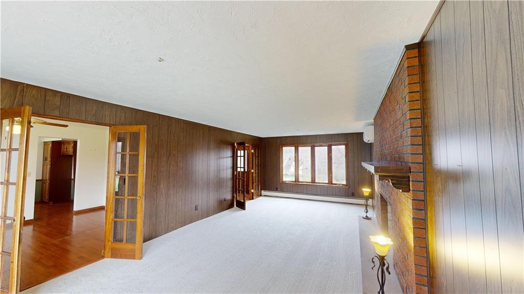 420 Sawmill Run Road Butler, PA 16001 - Photo 8 of 46 a view of a hallway with wooden floor and windows