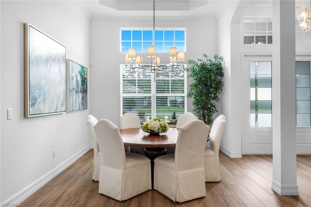 14630 Blue Bay Circle Fort Myers, FL 33913 - Photo 11 of 49 a view of a dining room with furniture window and wooden floor