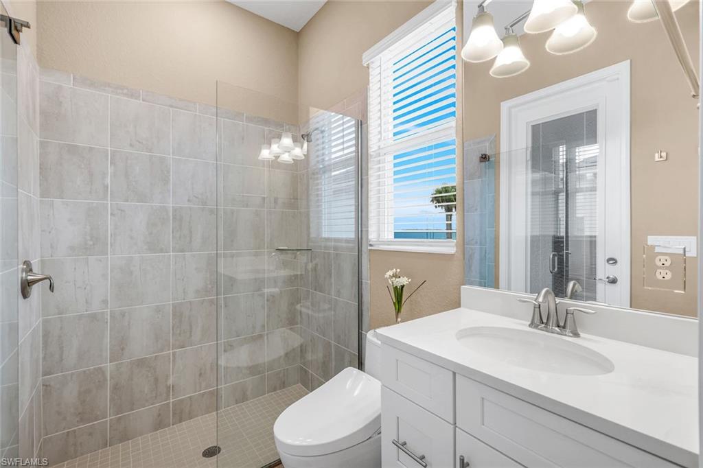 14630 Blue Bay Circle Fort Myers, FL 33913 - Photo 22 of 49 a bathroom with a sink a toilet and shower