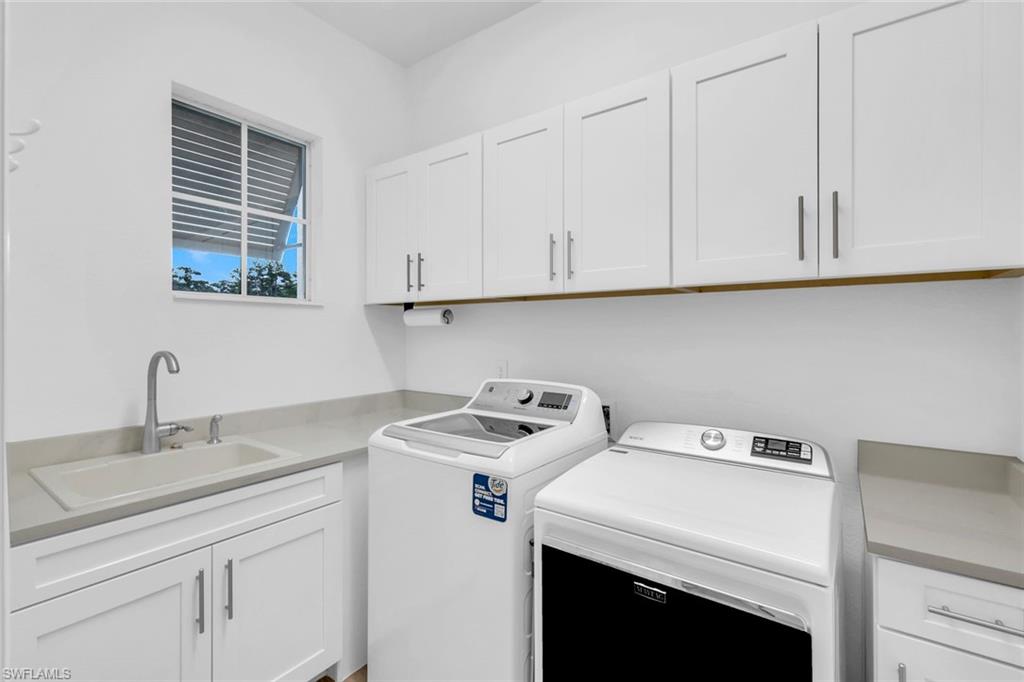 14630 Blue Bay Circle Fort Myers, FL 33913 - Photo 24 of 49 a utility room with dryer and washer