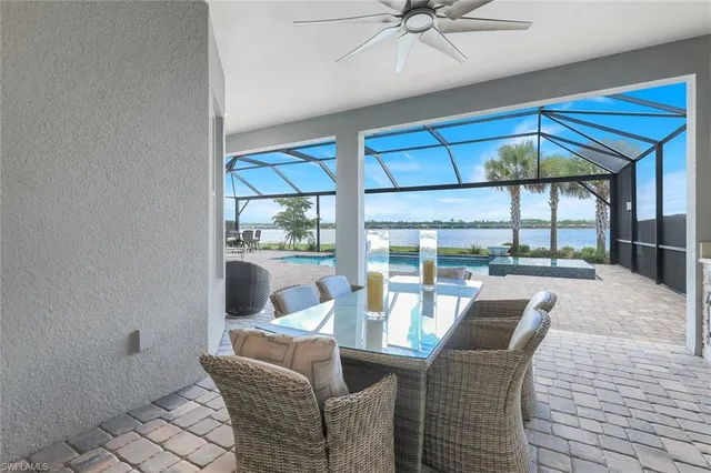 a living room with furniture a lamp and a table