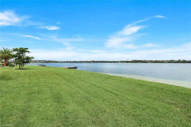 a view of a lake with a big yard