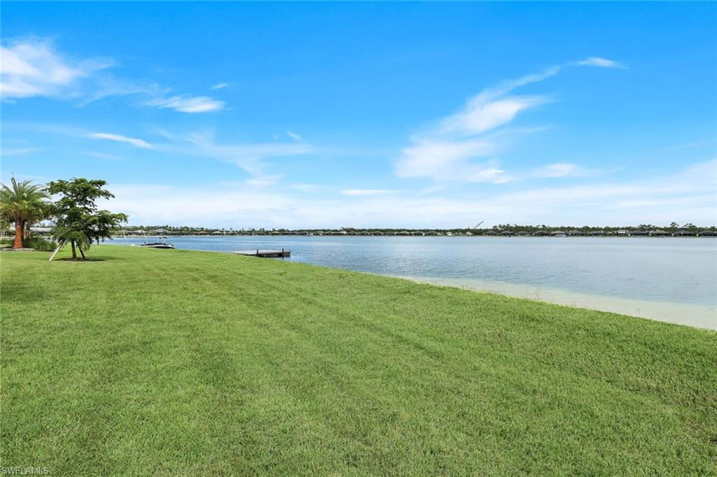 14630 Blue Bay Circle Fort Myers, FL 33913 - Photo 35 of 49 a view of a lake with houses in the background