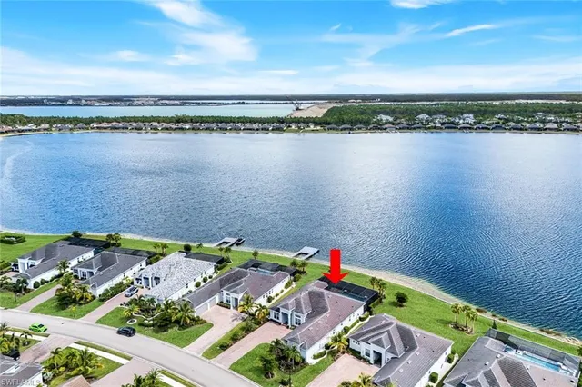 a view of a lake with houses in the background