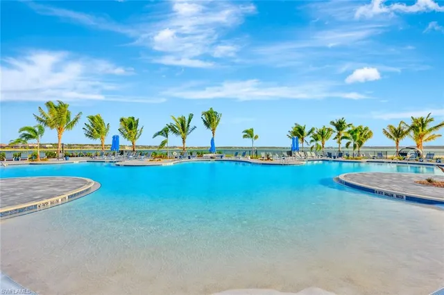 a view of a city and a mountain view in a lake