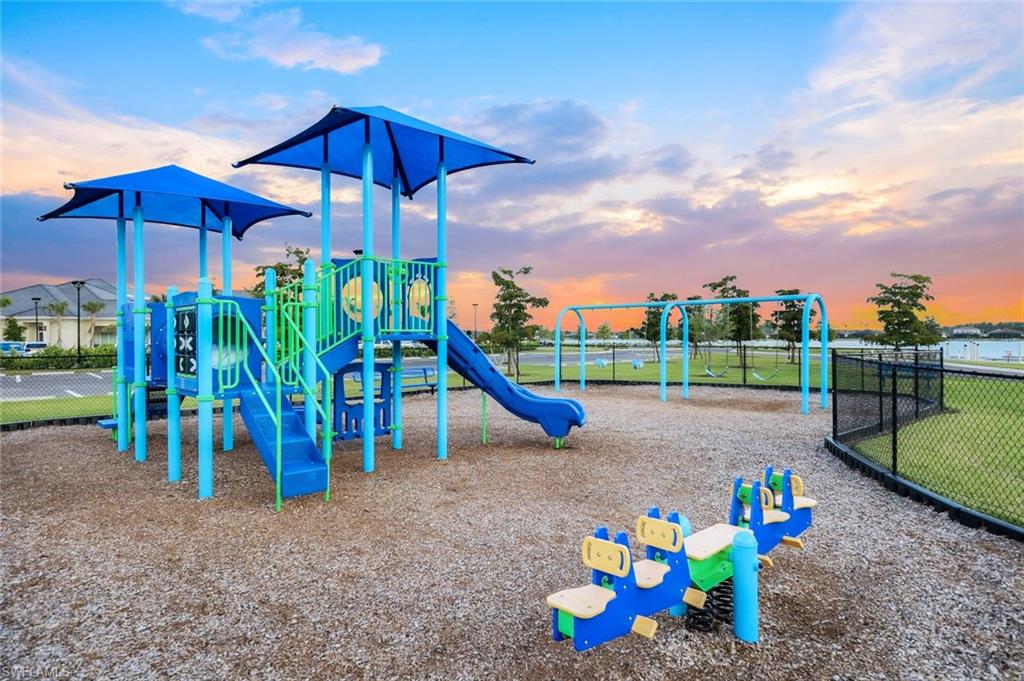 14630 Blue Bay Circle Fort Myers, FL 33913 - Photo 43 of 49 a view of a park with swings and slides