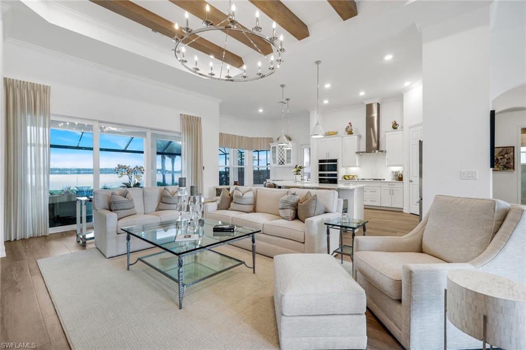 14630 Blue Bay Circle Fort Myers, FL 33913 - Photo 5 of 49 a living room with furniture kitchen view and a chandelier