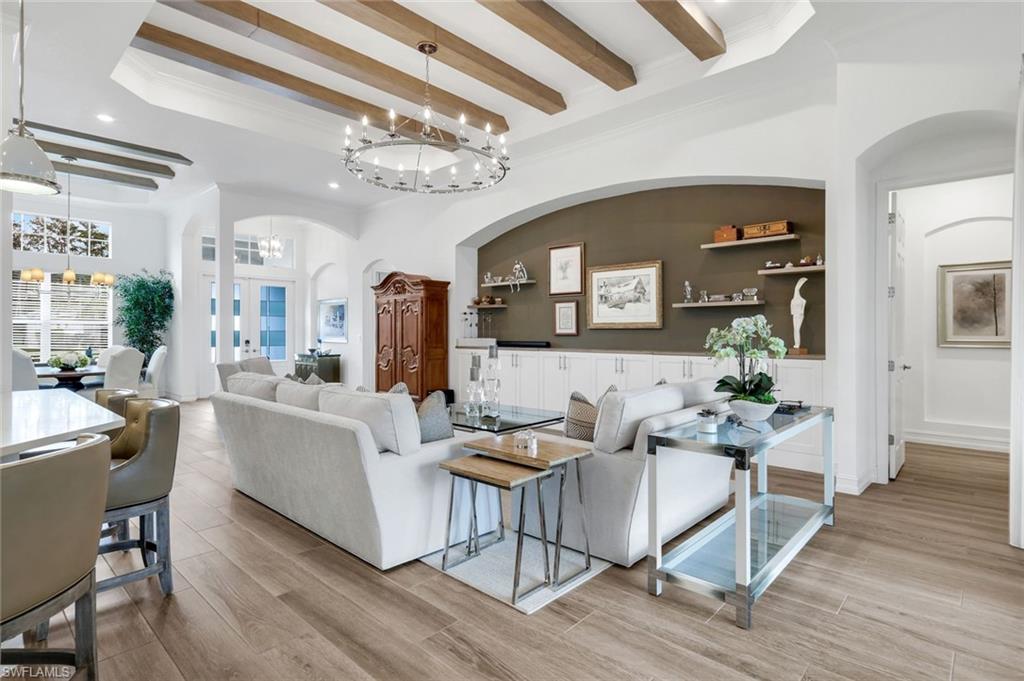 14630 Blue Bay Circle Fort Myers, FL 33913 - Photo 6 of 49 a living room with furniture and a chandelier