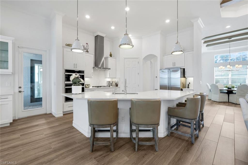 14630 Blue Bay Circle Fort Myers, FL 33913 - Photo 8 of 49 a large kitchen with a table and chairs