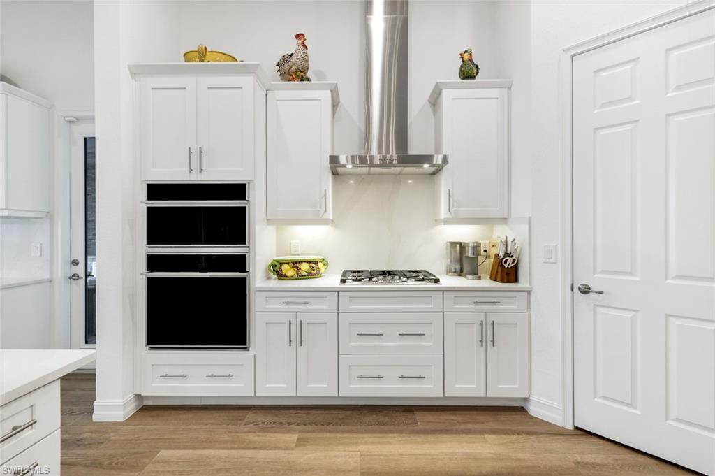 14630 Blue Bay Circle Fort Myers, FL 33913 - Photo 9 of 49 a kitchen with stainless steel appliances a stove and a refrigerator