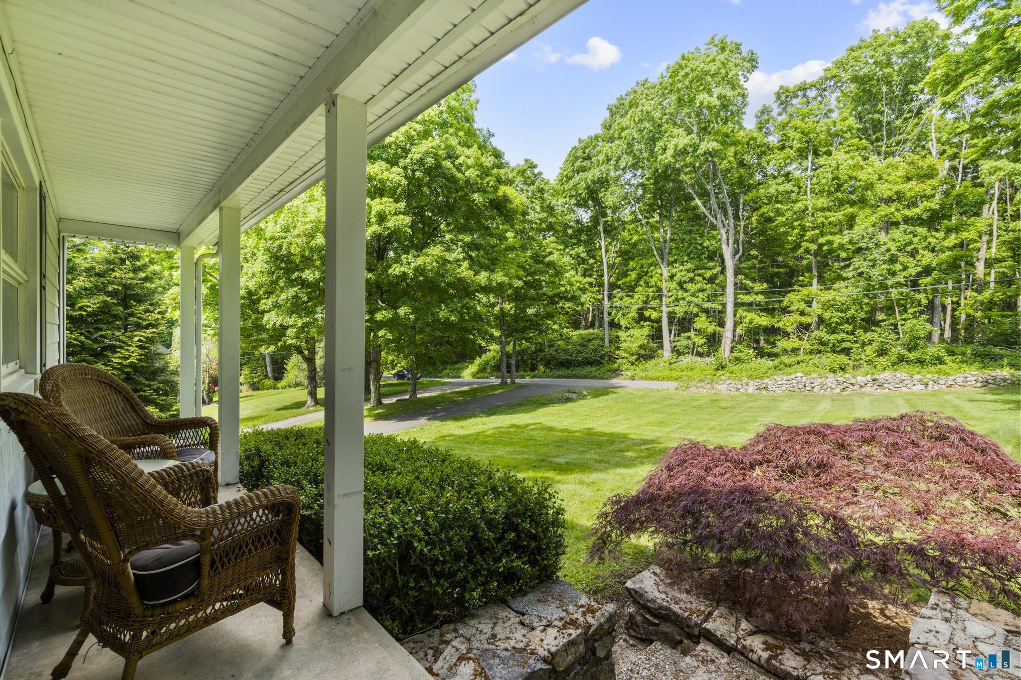 200 Old Huckleberry Road Wilton, CT 06897 - Photo 20 of 24 a view of yard with green space and porch