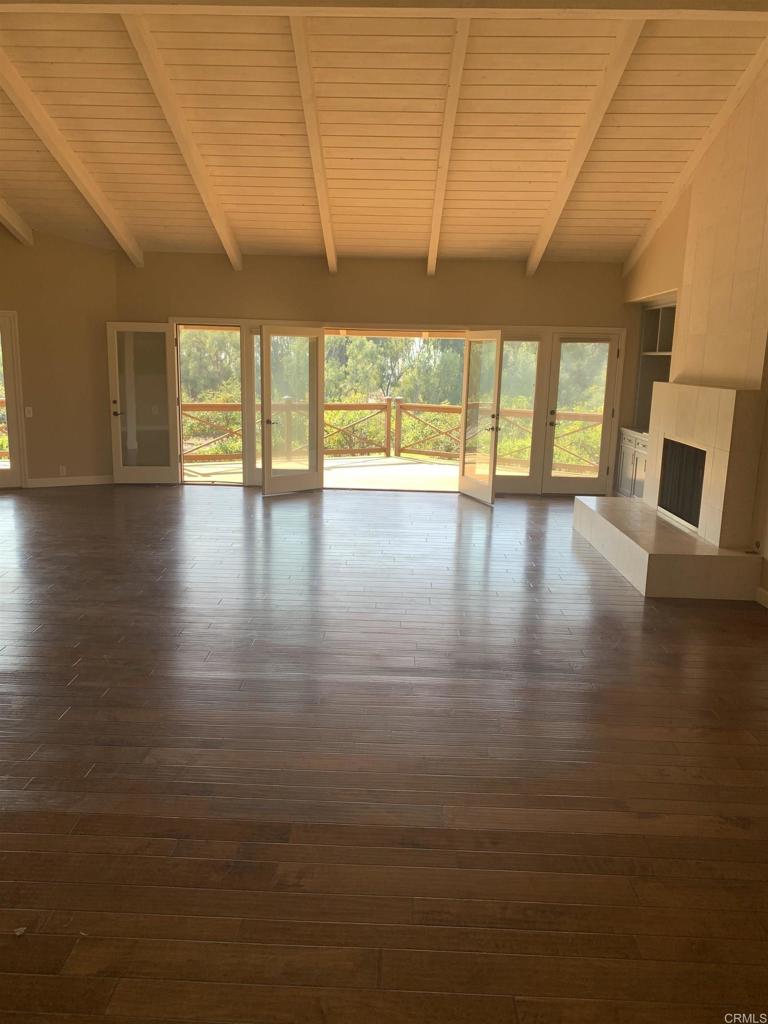 6858 Las Colinas Rancho Santa Fe, CA 92067 - Photo 14 of 23 a view of empty room with wooden floor and fan