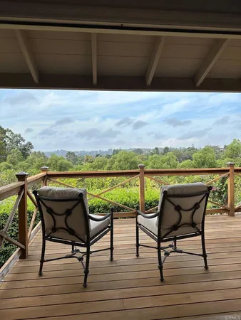 a view of a chairs and table on the terrace