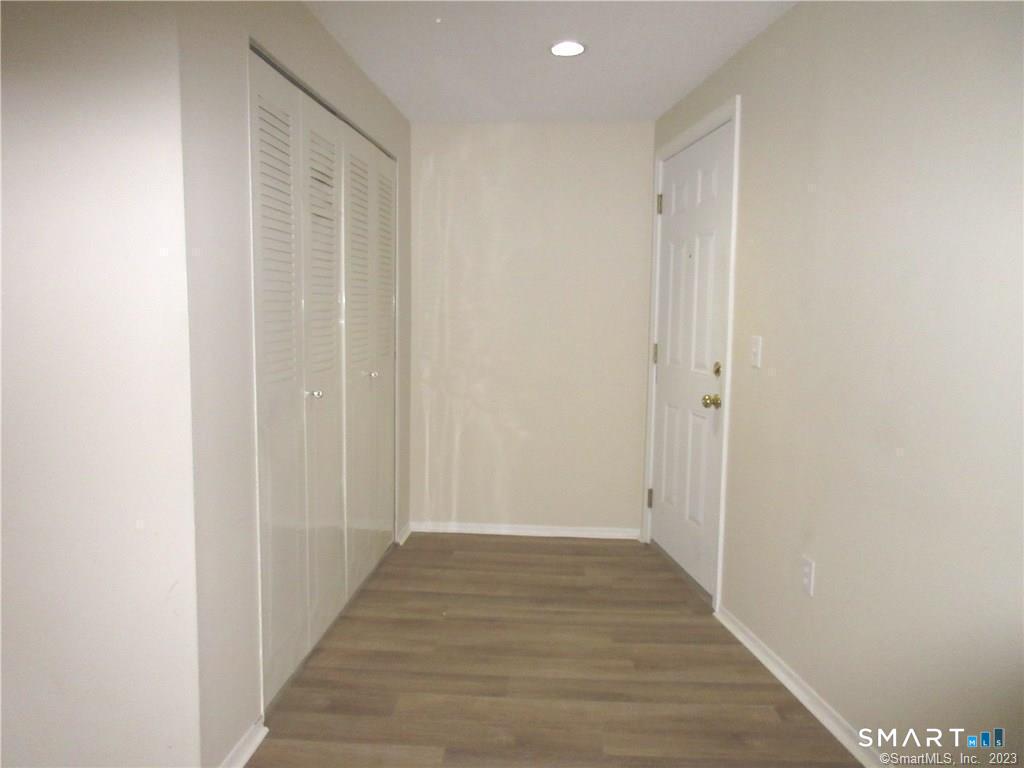 5 Nabby Road, Unit A51 Danbury, CT 06811 - Photo 4 of 13 a view of a hallway with wooden floor