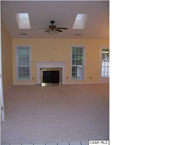 837 Harris Road Charlottesville, VA 22902 - Photo 5 of 20 a living room with furniture and a fireplace