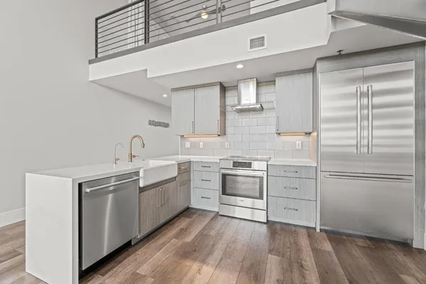 a kitchen with cabinets and white appliances