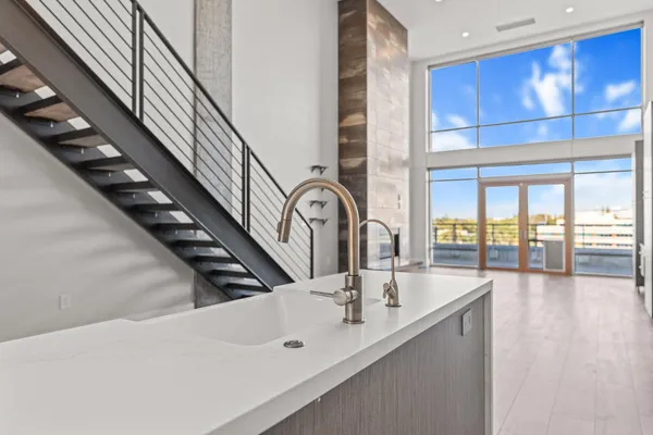 a bathroom with a double vanity sink and a large mirror