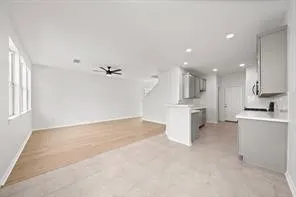 a view of a kitchen with a sink and cabinets
