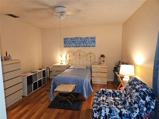 a bedroom with bed and a window