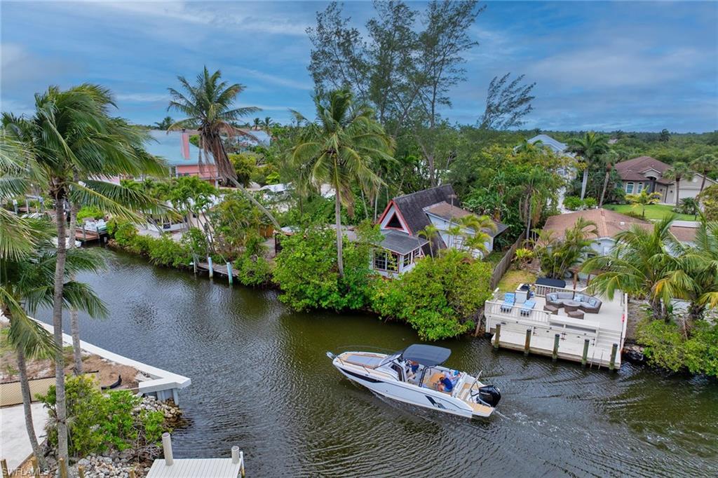3261 Lakeview Drive Naples, FL 34112 - Photo 2 of 18 an aerial view of a house with outdoor space lake view and boat