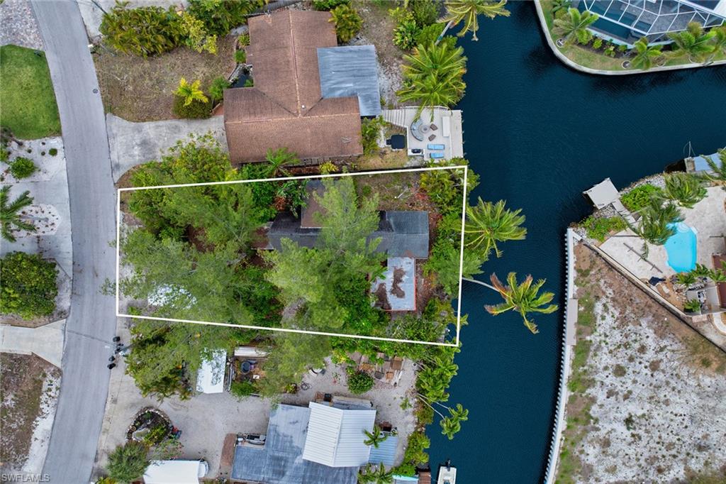 3261 Lakeview Drive Naples, FL 34112 - Photo 6 of 18 an aerial view of a house with a garden and plants