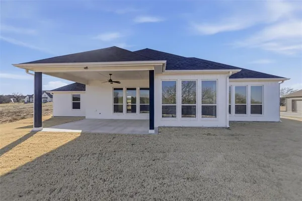 a view of a house with a yard and balcony