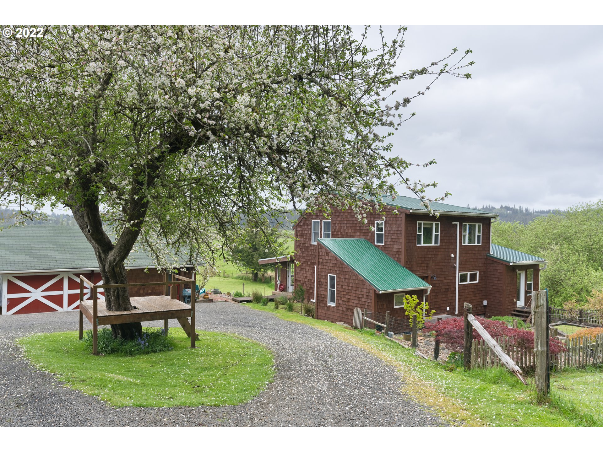 89907 Youngs River Road Astoria, OR 97103 - Photo 1 of 32 a house with a tree in the background