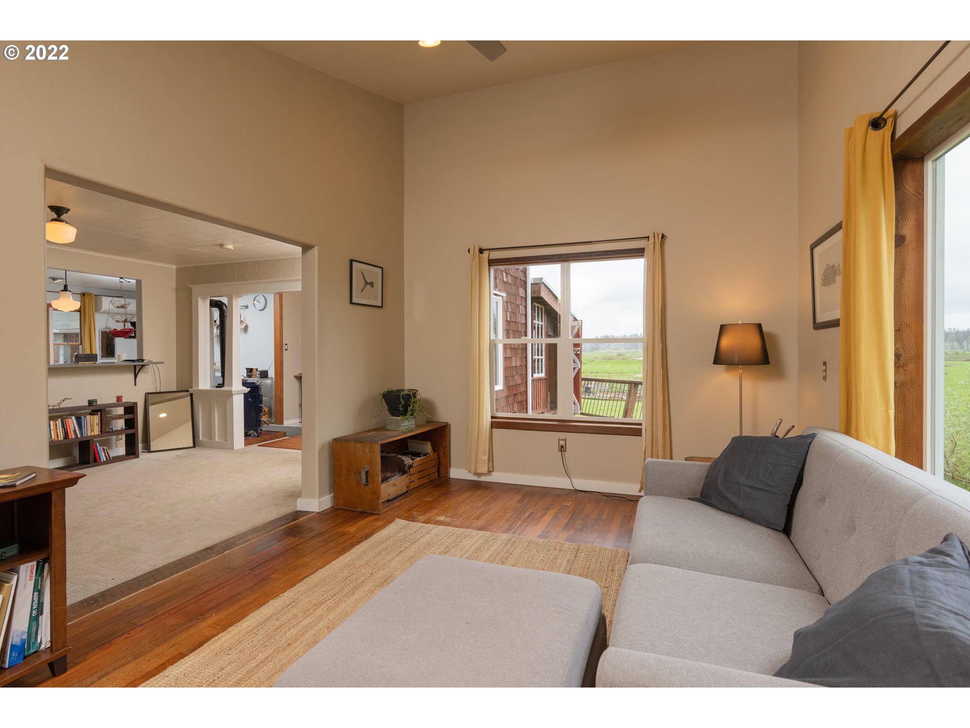 89907 Youngs River Road Astoria, OR 97103 - Photo 13 of 32 a living room with furniture and a large window