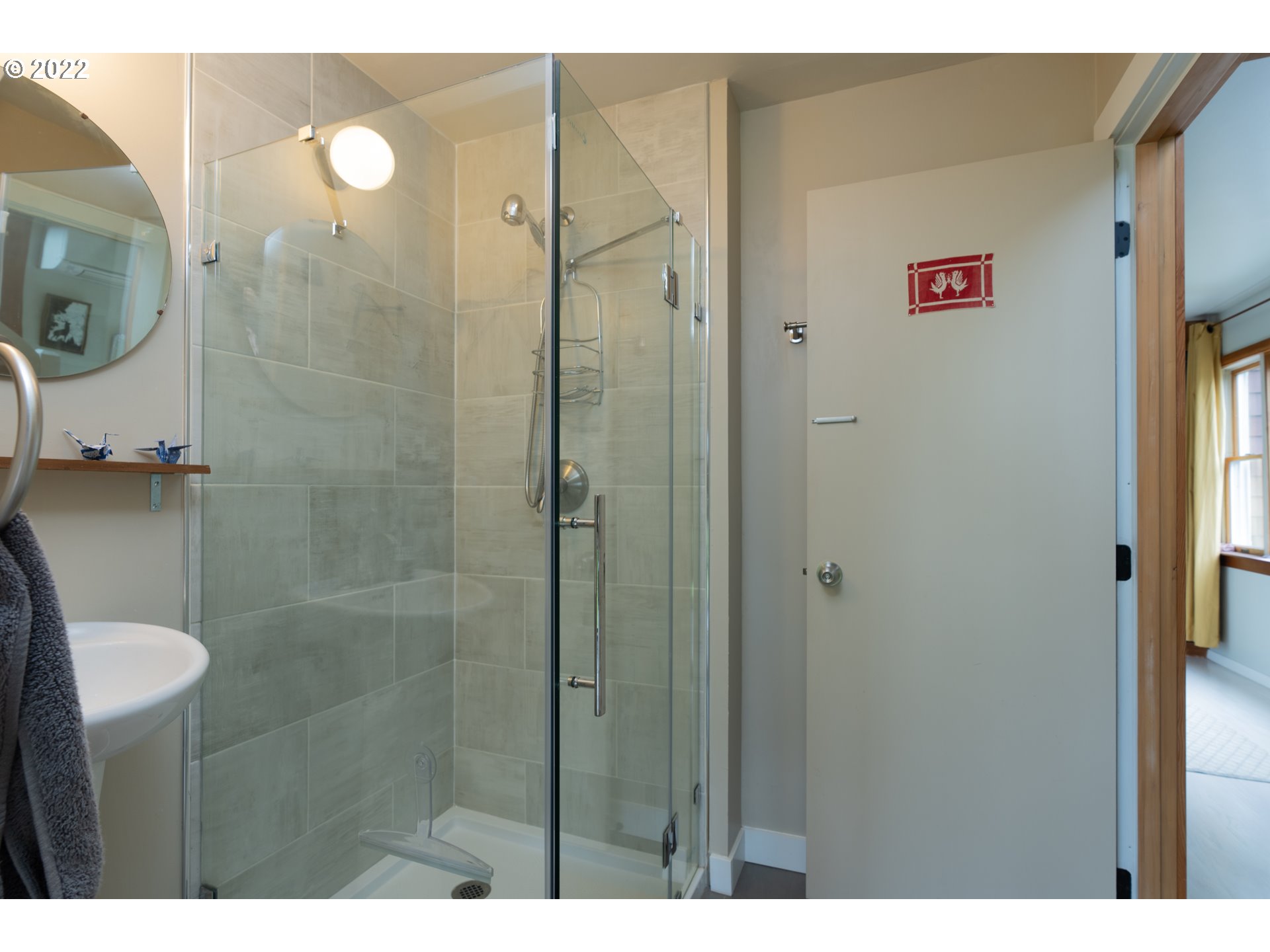 89907 Youngs River Road Astoria, OR 97103 - Photo 14 of 32 a bathroom with a shower and a sink
