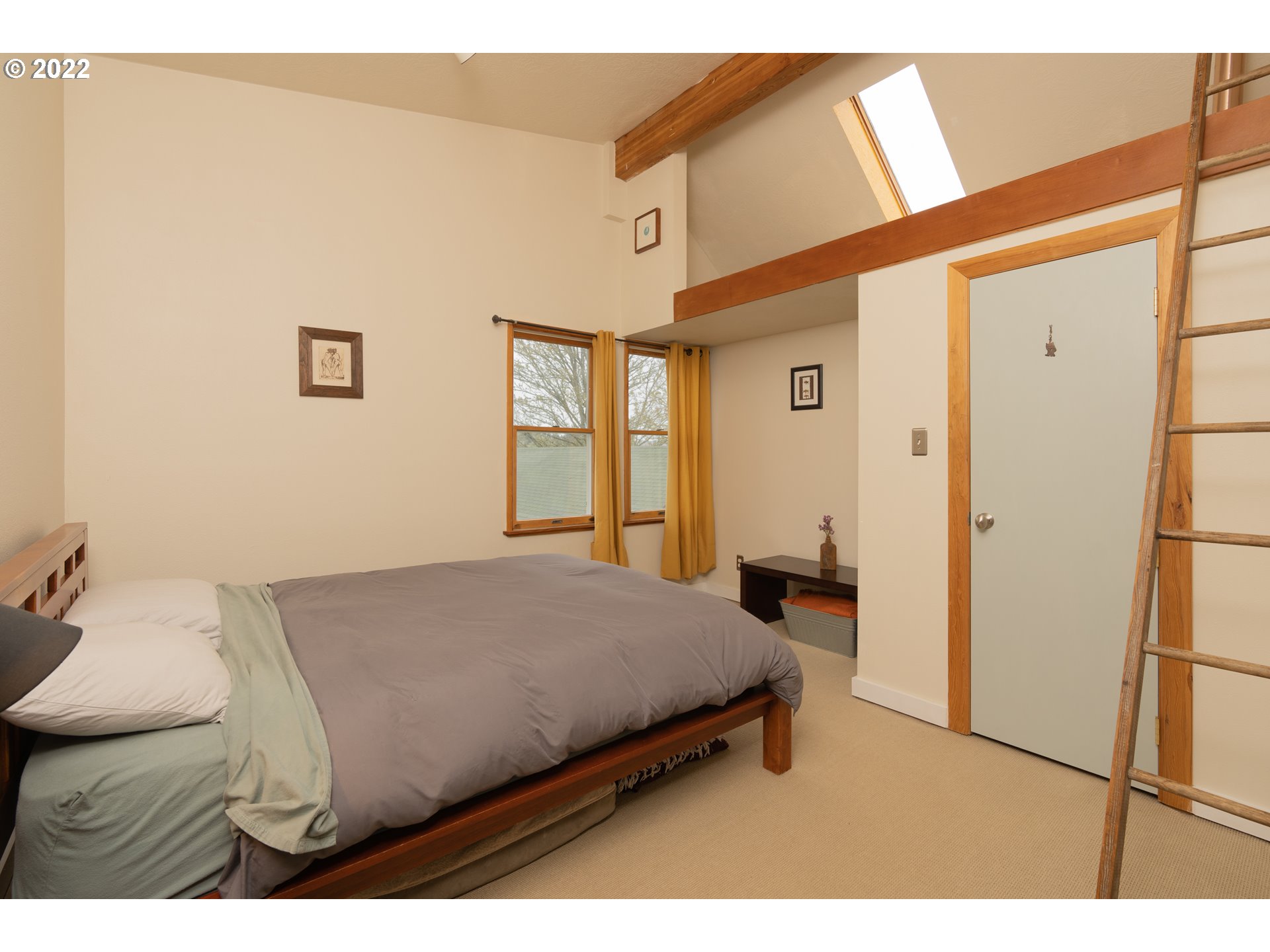 89907 Youngs River Road Astoria, OR 97103 - Photo 20 of 32 a bedroom with a bed and a dresser