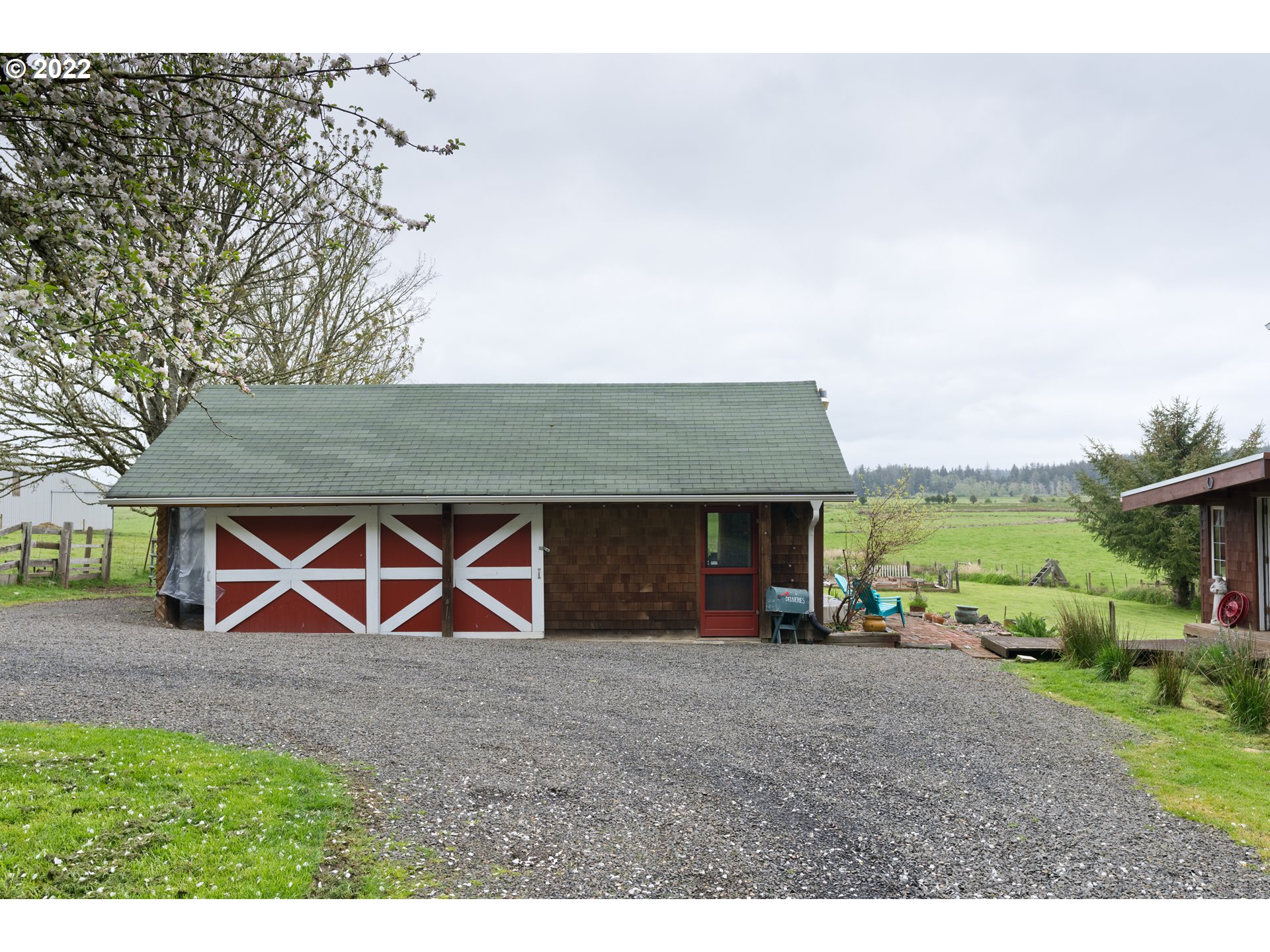 89907 Youngs River Road Astoria, OR 97103 - Photo 26 of 32 a front view of a house with garden