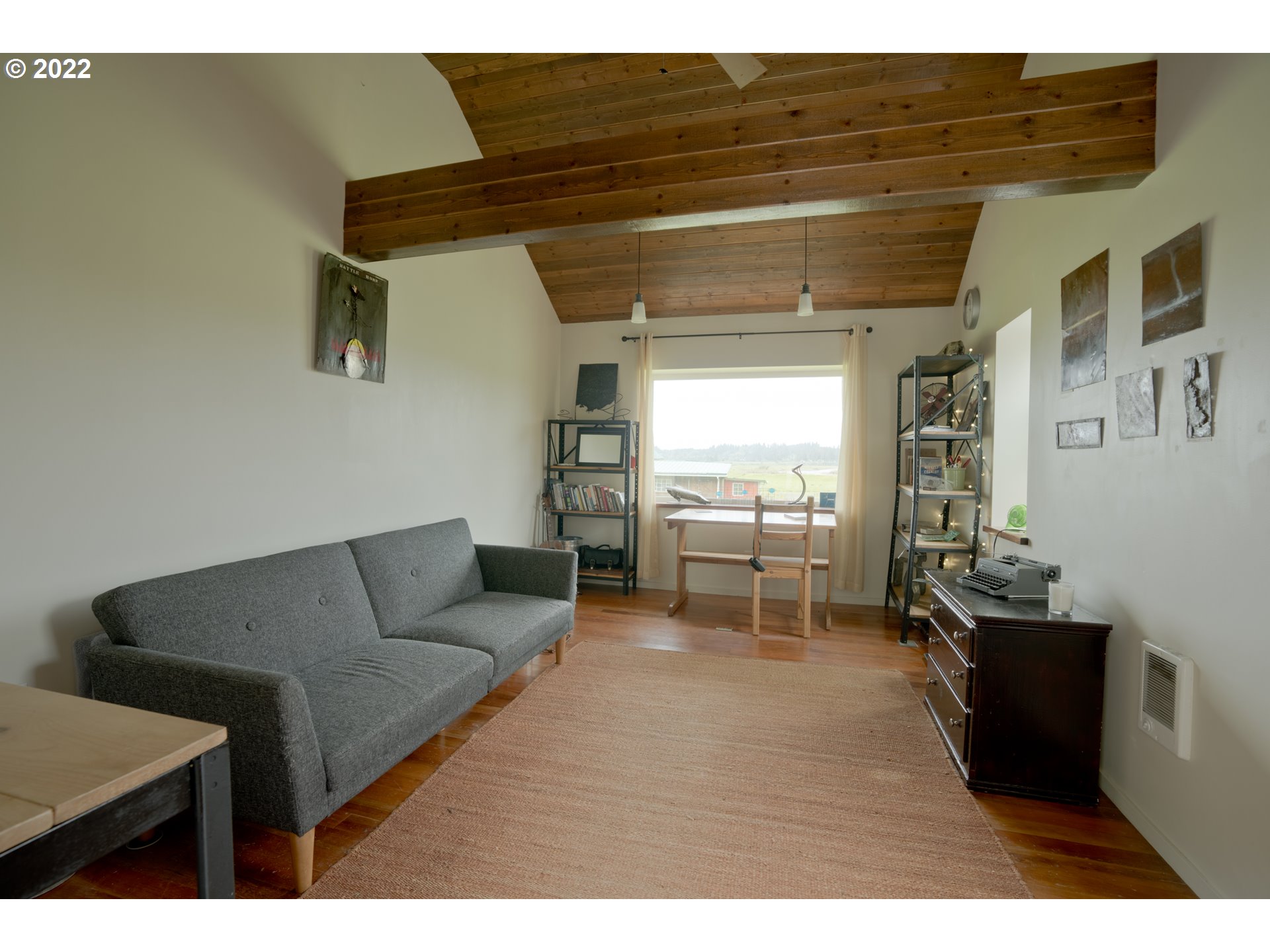 89907 Youngs River Road Astoria, OR 97103 - Photo 27 of 32 a living room with furniture and a large window