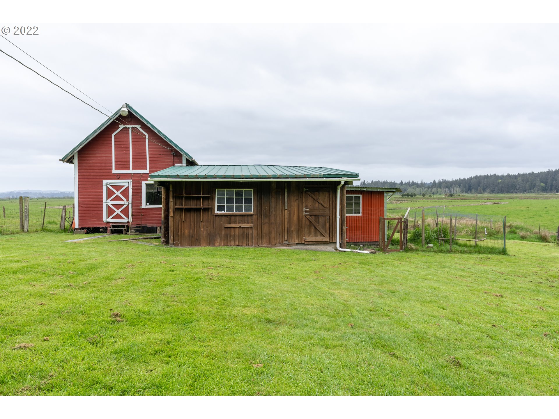 89907 Youngs River Road Astoria, OR 97103 - Photo 28 of 32 a front view of a house with a garden