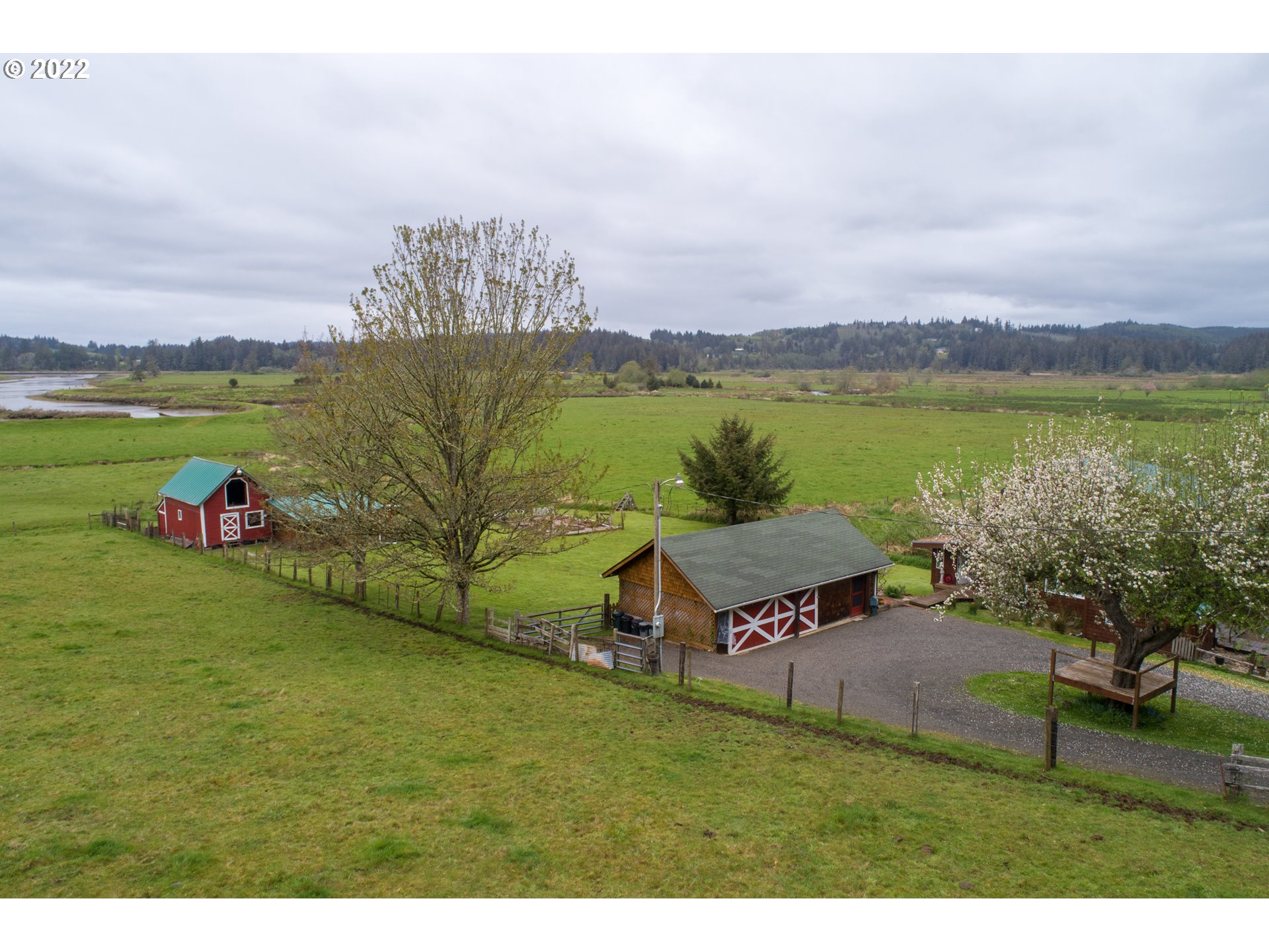 89907 Youngs River Road Astoria, OR 97103 - Photo 3 of 32 a view of a lake with a yard