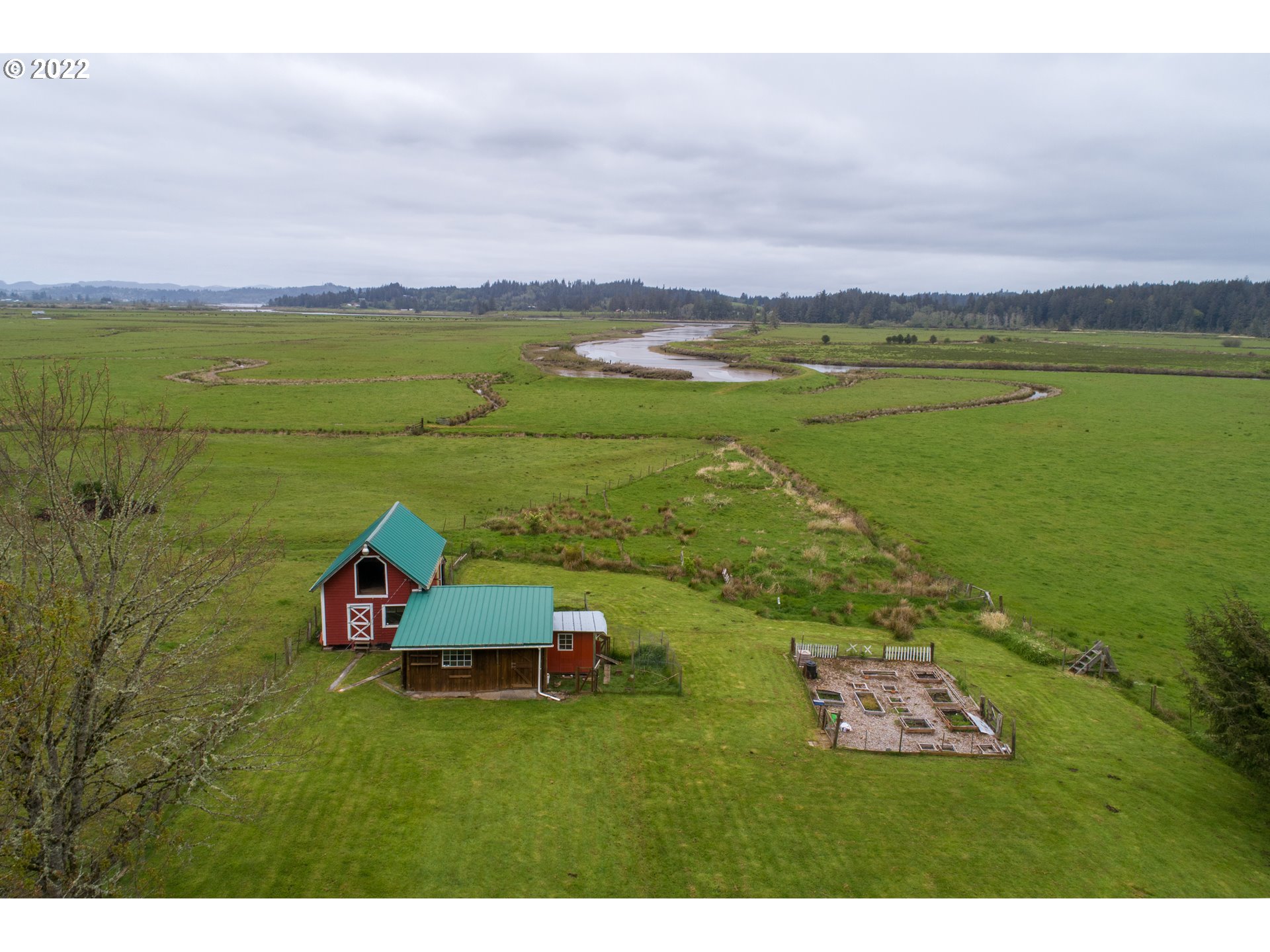 89907 Youngs River Road Astoria, OR 97103 - Photo 4 of 32 a view of a lake with a houses