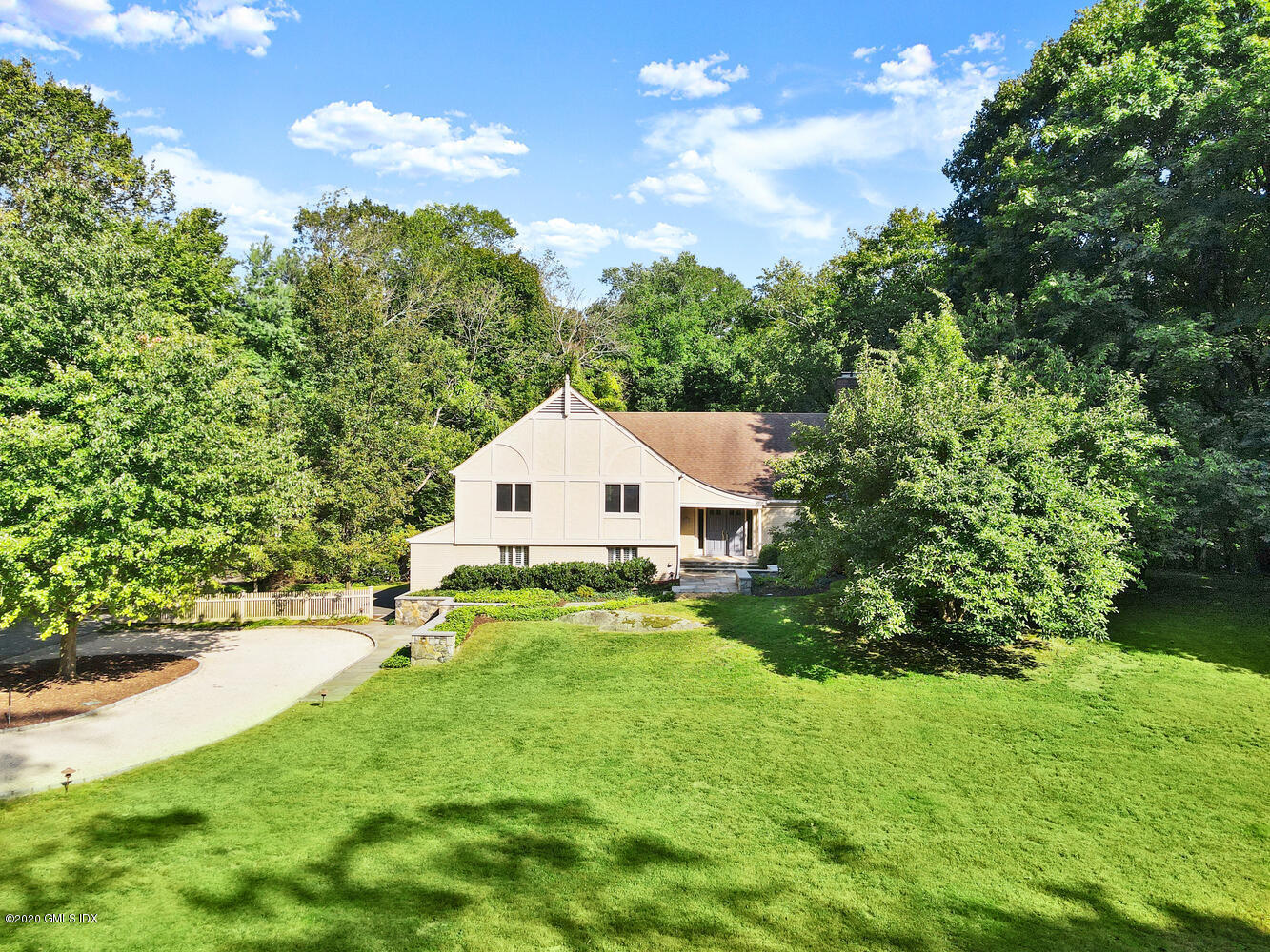 a view of a backyard with table and chairs and potted plants