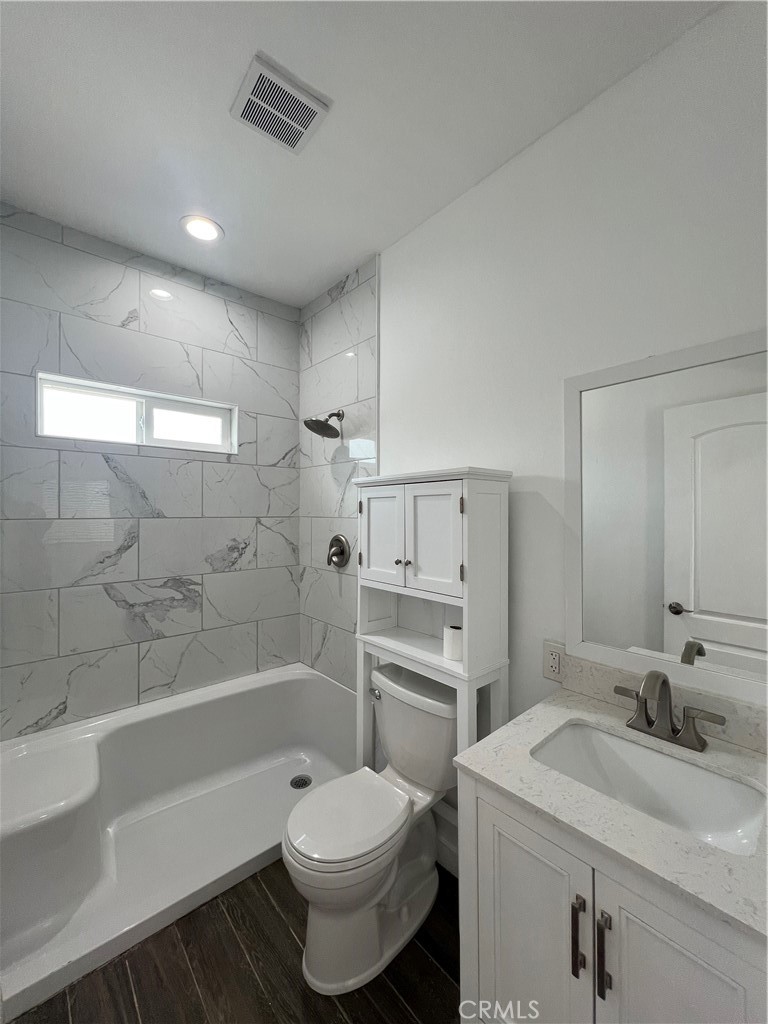 2357 Ellen Street Colton, CA 92324 - Photo 11 of 15 a bathroom with a sink toilet a bathtub and vanity