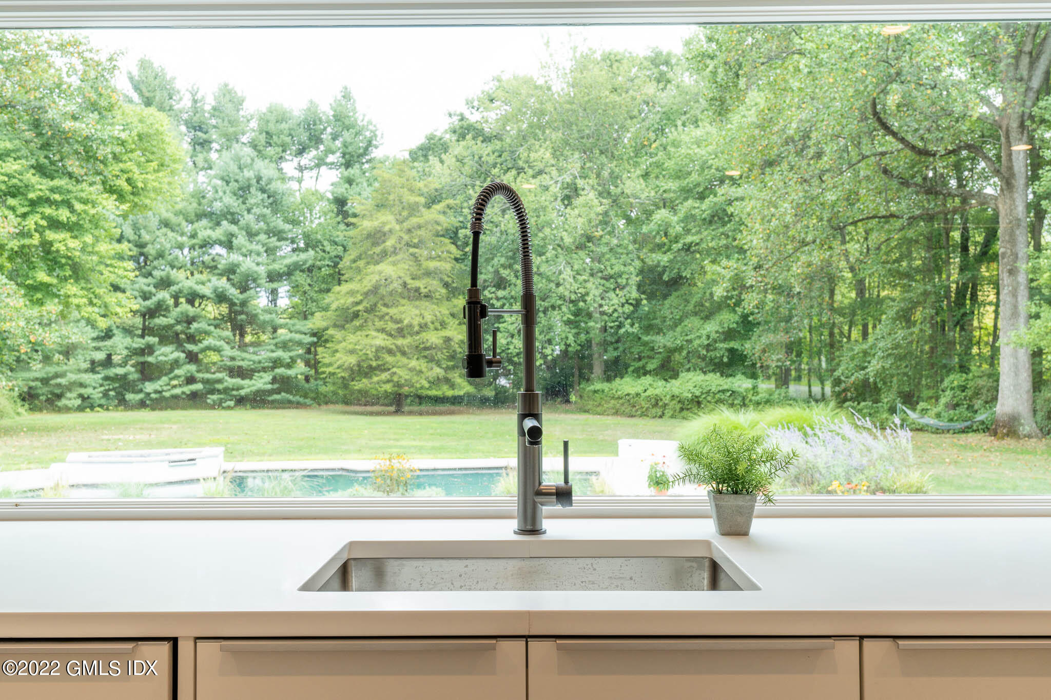 21 Hedgerow Lane Greenwich, CT 06831 - Photo 16 of 35 a view of a garden from a window