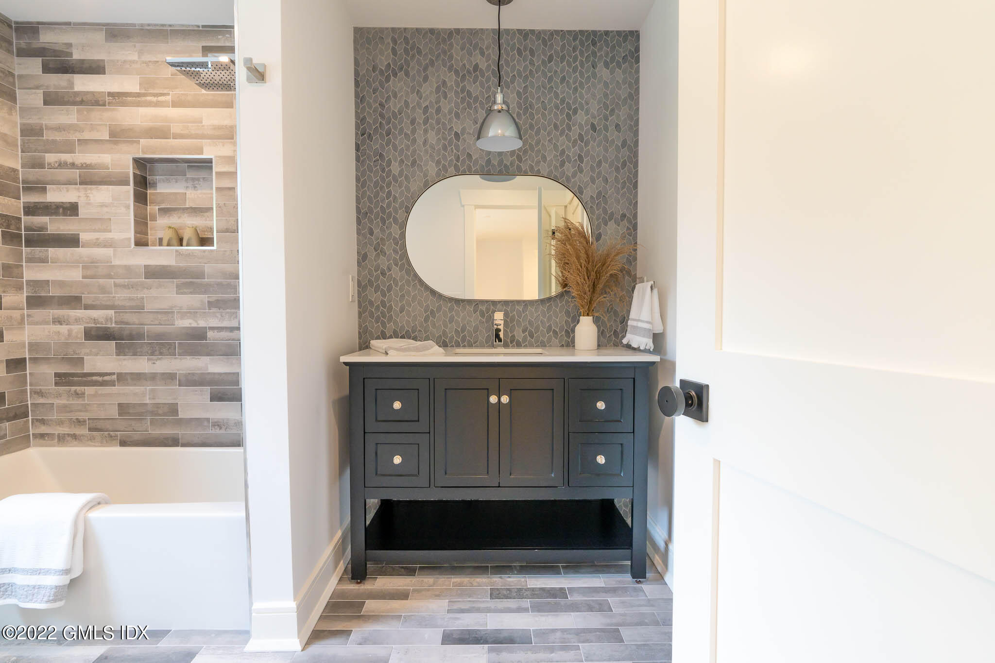 21 Hedgerow Lane Greenwich, CT 06831 - Photo 22 of 35 a bathroom with a sink a vanity and a mirror