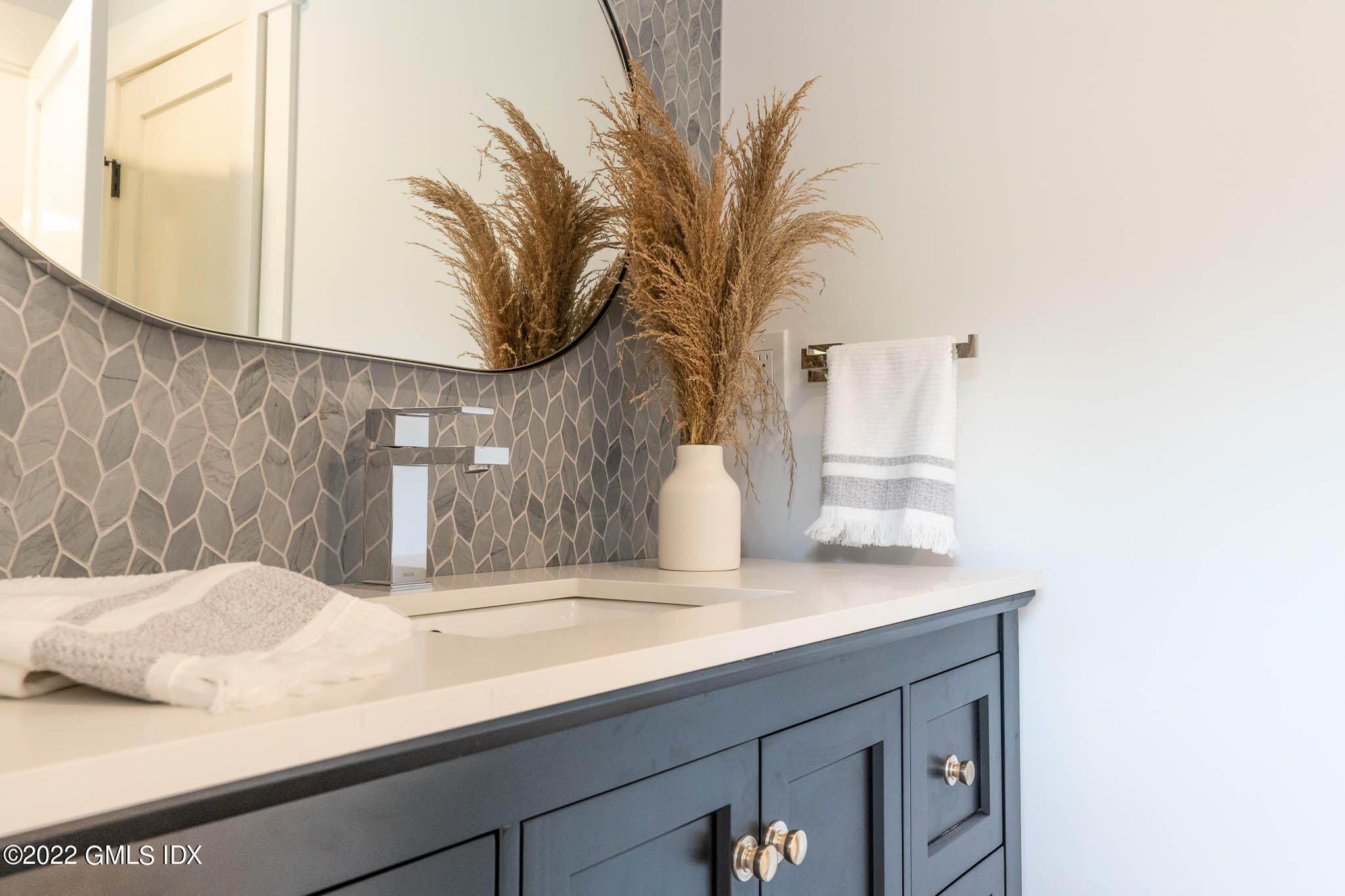 21 Hedgerow Lane Greenwich, CT 06831 - Photo 23 of 35 a bathroom with a sink and a mirror
