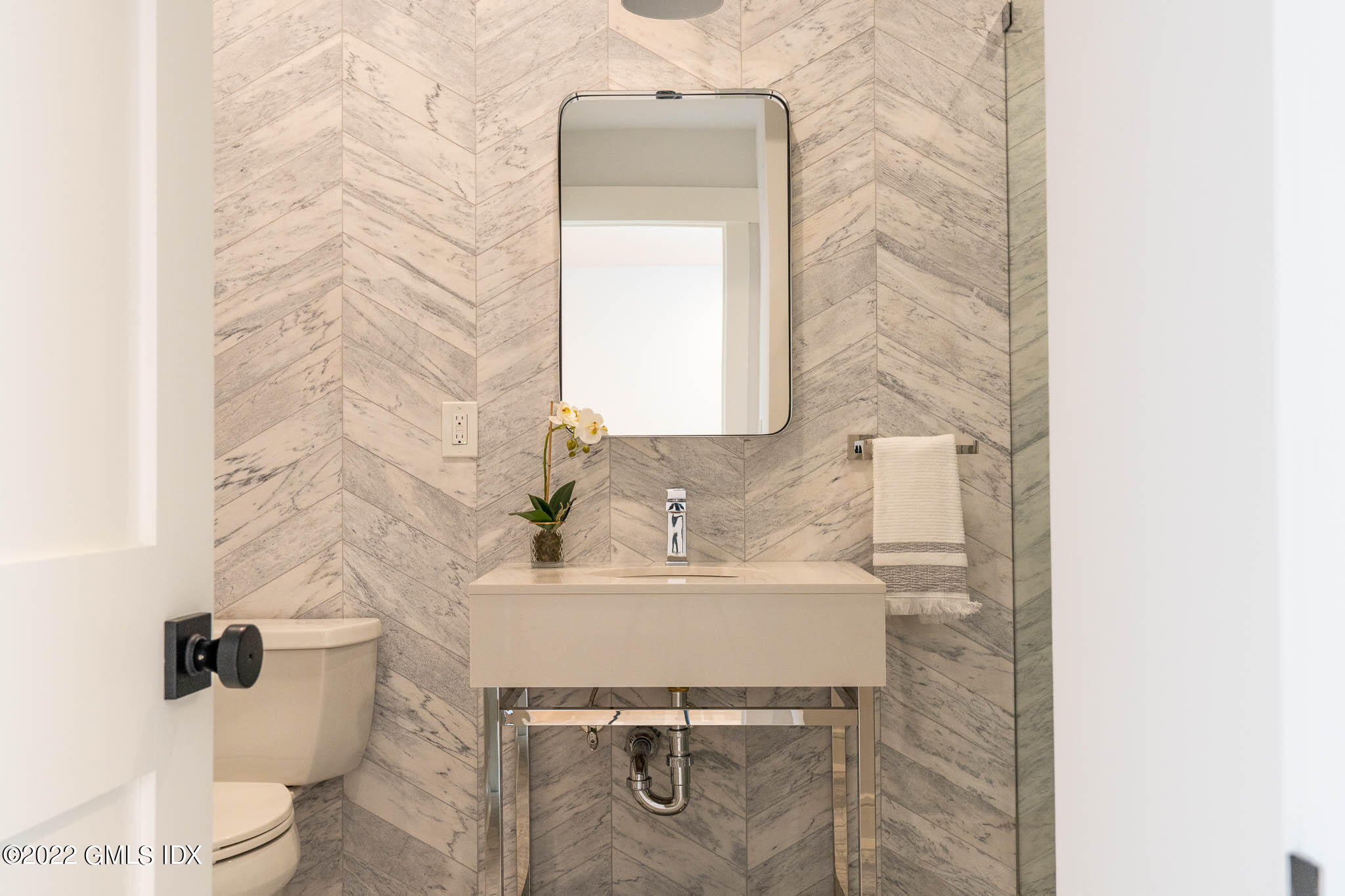 21 Hedgerow Lane Greenwich, CT 06831 - Photo 24 of 35 a bathroom with a sink toilet and mirror