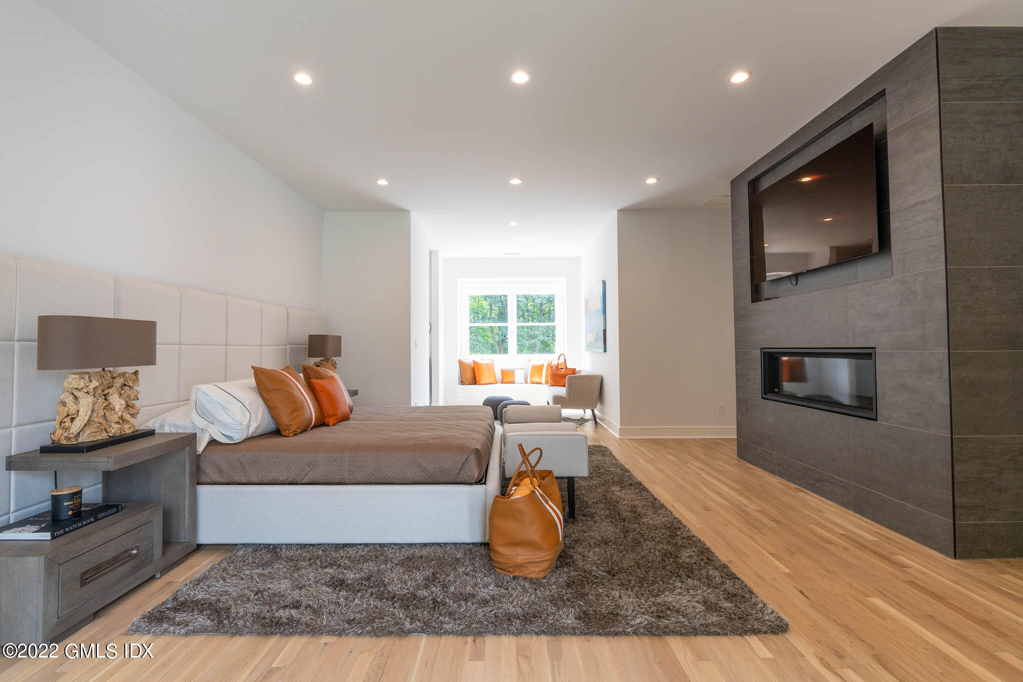 21 Hedgerow Lane Greenwich, CT 06831 - Photo 27 of 35 a living room with furniture and a fireplace