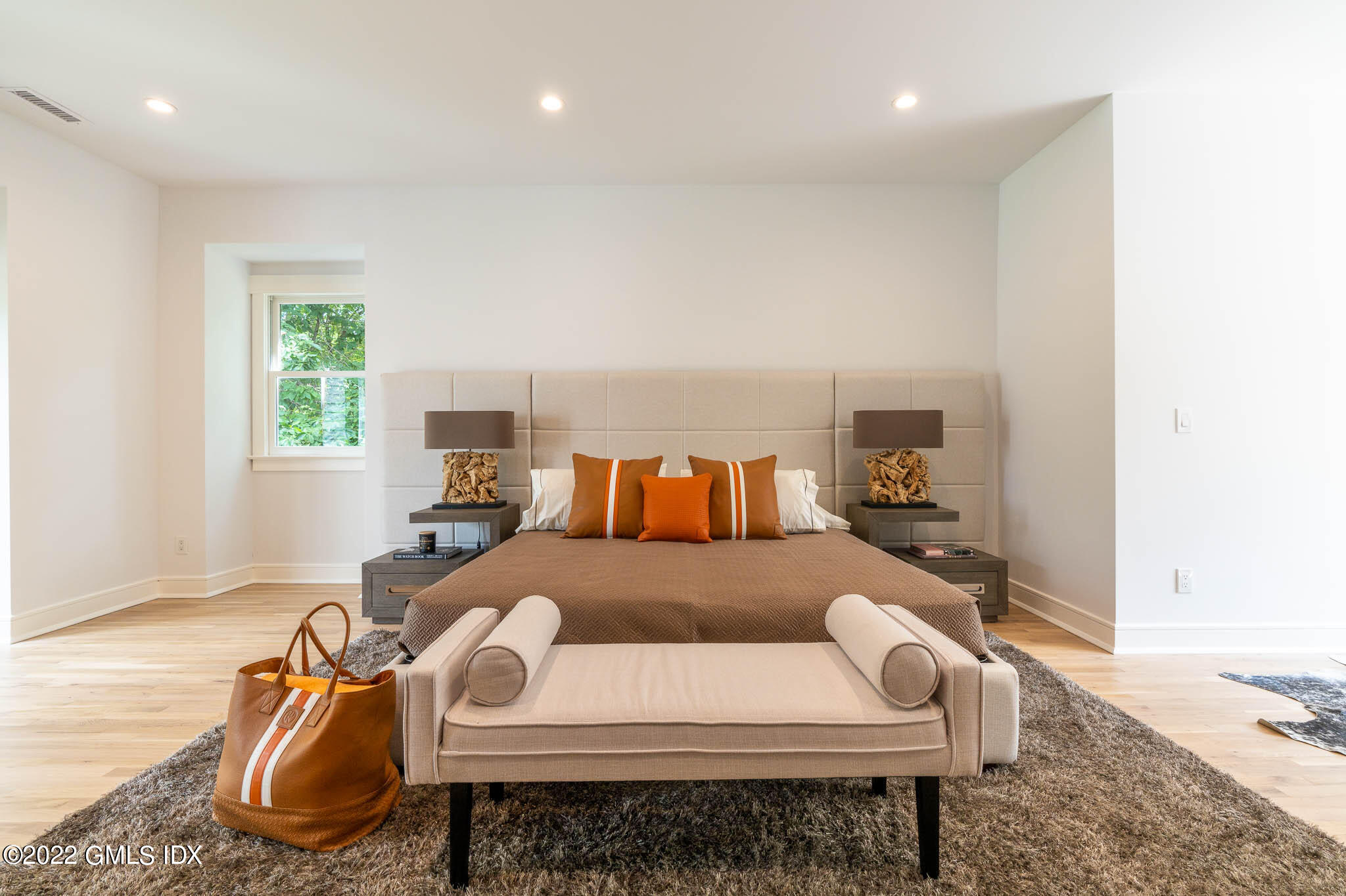 21 Hedgerow Lane Greenwich, CT 06831 - Photo 28 of 35 a bed room with a bed and a chair