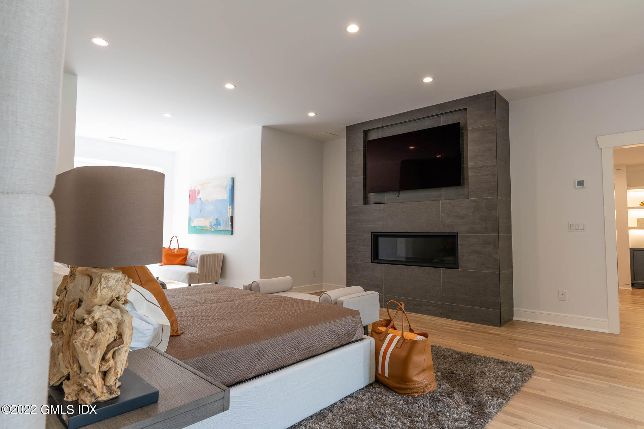 21 Hedgerow Lane Greenwich, CT 06831 - Photo 29 of 35 a bedroom with a bed and a television