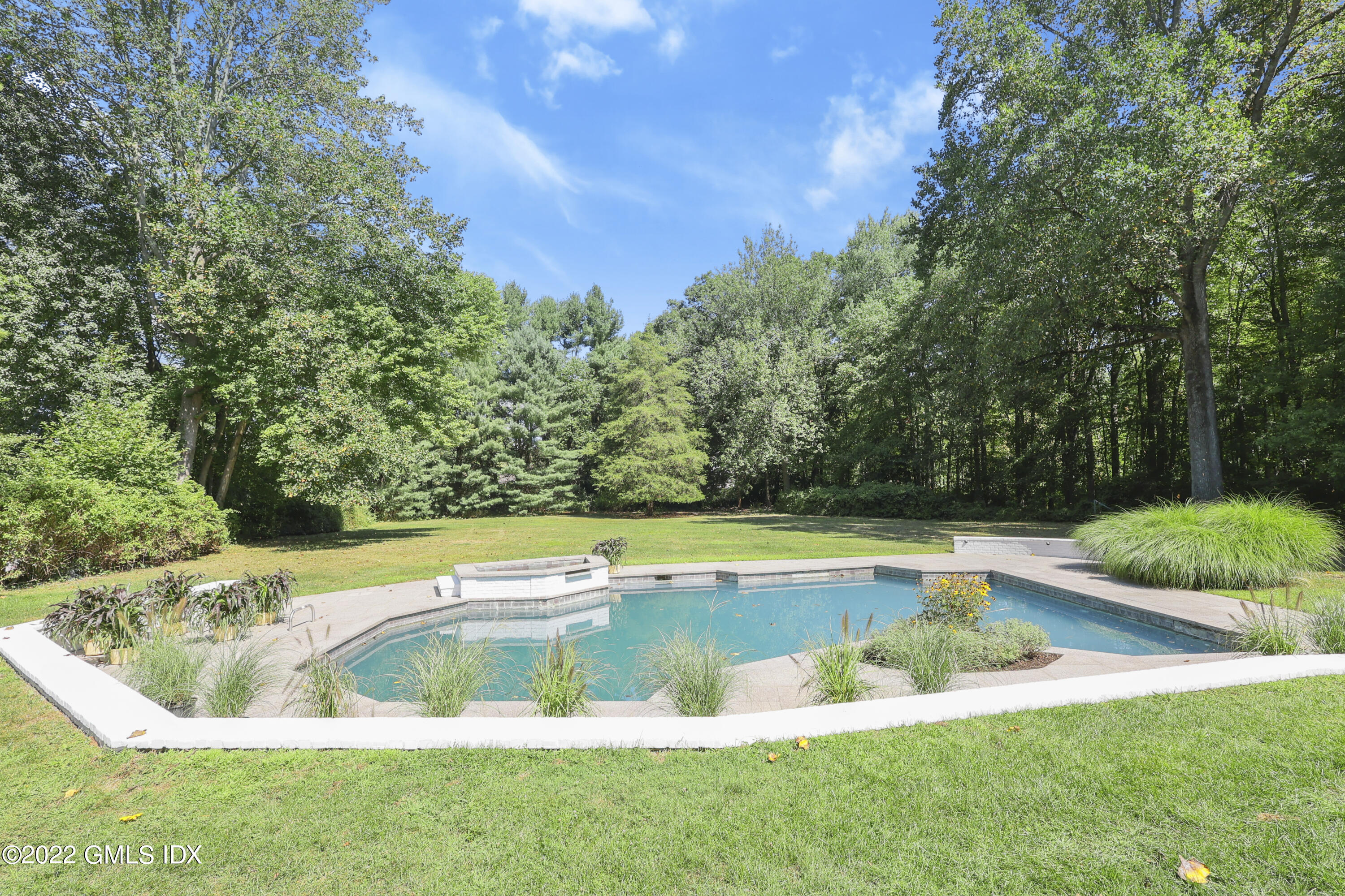 21 Hedgerow Lane Greenwich, CT 06831 - Photo 34 of 35 a view of a swimming pool with a yard