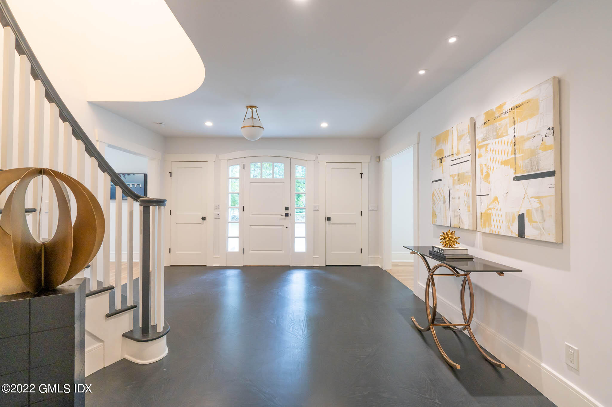 21 Hedgerow Lane Greenwich, CT 06831 - Photo 4 of 35 a view of a livingroom with wooden floor and staircase