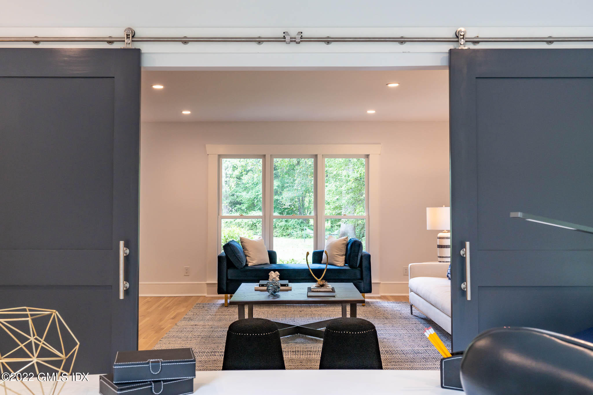 21 Hedgerow Lane Greenwich, CT 06831 - Photo 8 of 35 a living room with furniture and a large window