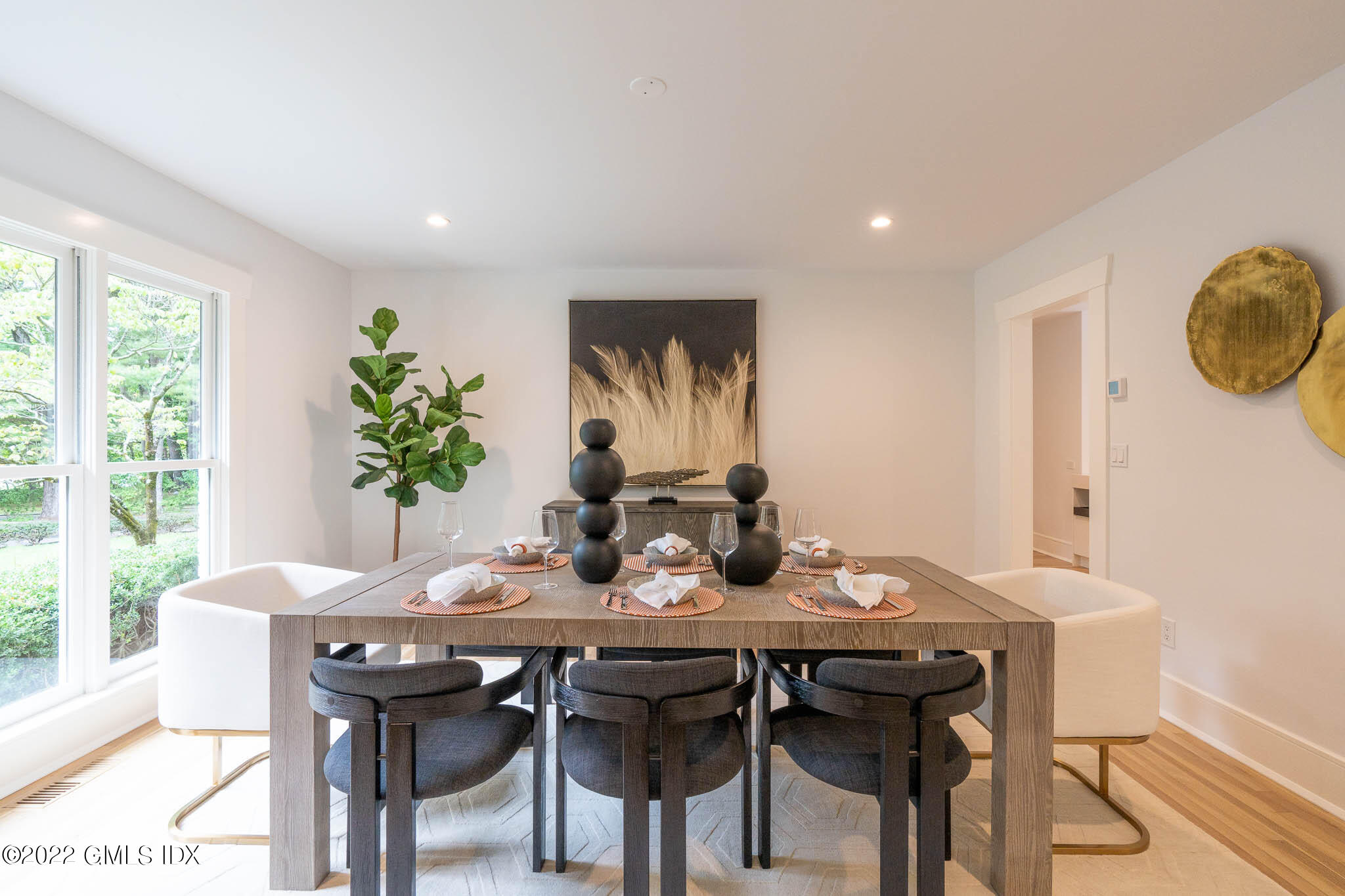 21 Hedgerow Lane Greenwich, CT 06831 - Photo 10 of 35 a view of a dining room that has a table and chairs in it