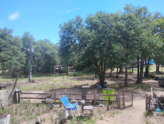 647 Hidden Oaks Drive Elgin, TX 78621 - Photo 3 of 5 a view of a yard with sitting area