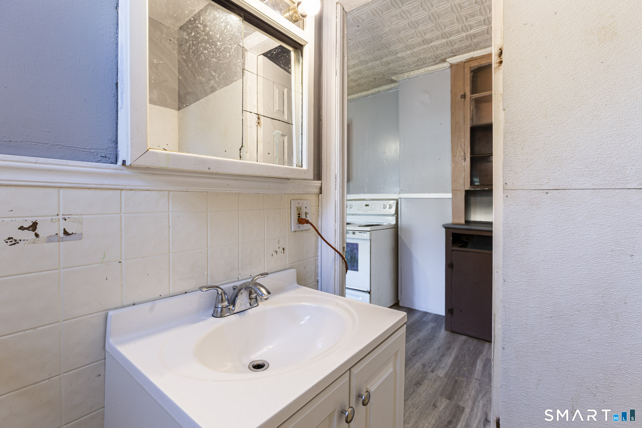 17 Hawthorne Terrace Torrington, CT 06790 - Photo 13 of 37 a bathroom with a sink and a mirror